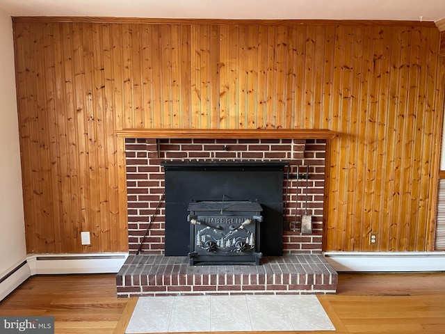 interior details featuring wooden walls and a baseboard radiator