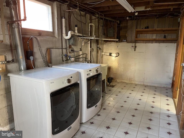 washroom with washing machine and clothes dryer