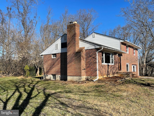 view of home's exterior featuring a lawn