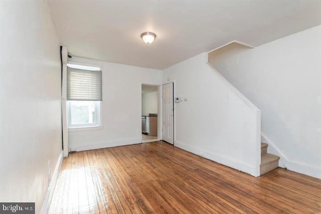 spare room with wood-type flooring