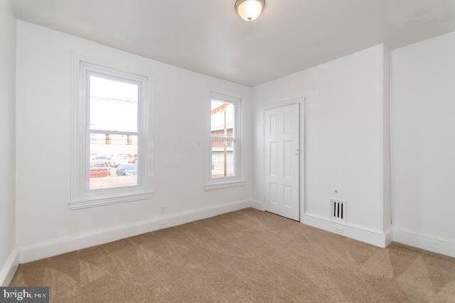 spare room featuring carpet flooring