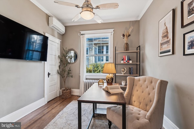 office area with ceiling fan, radiator heating unit, a wall mounted air conditioner, crown molding, and hardwood / wood-style floors