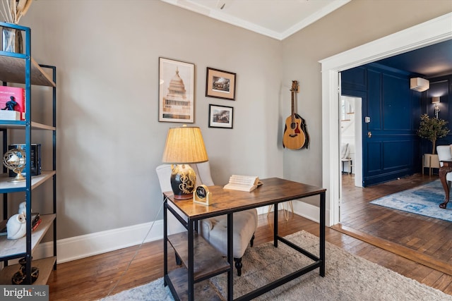 office area with dark hardwood / wood-style flooring and crown molding