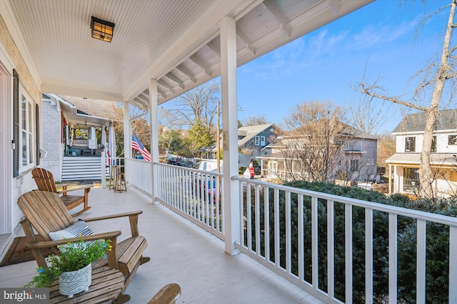 balcony featuring a porch