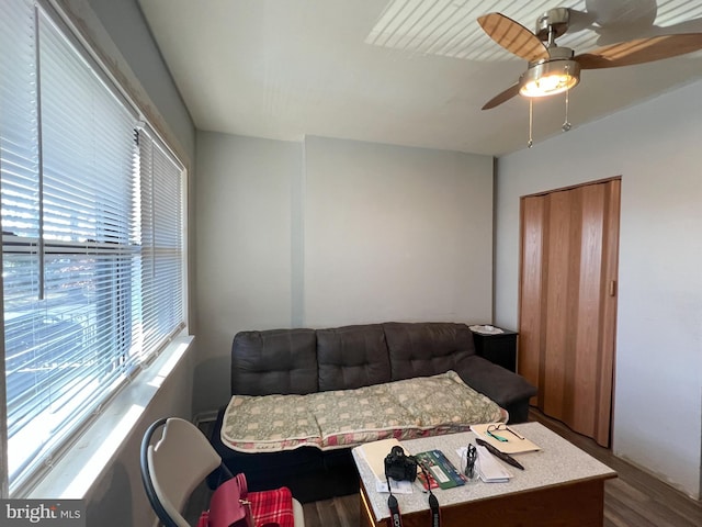 bedroom with wood-type flooring and ceiling fan