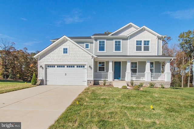 craftsman-style house featuring covered porch, a garage, and a front lawn