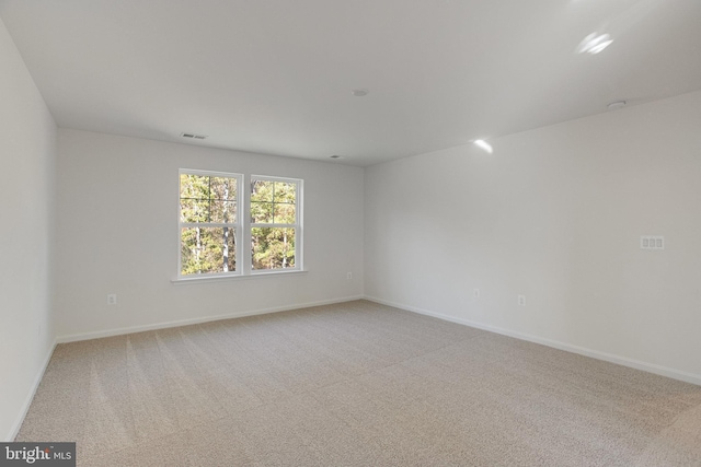 spare room with light carpet