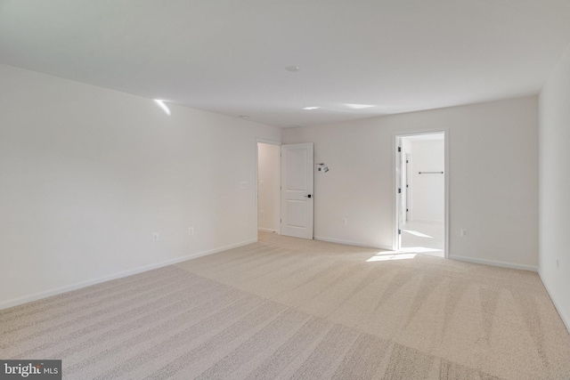 empty room with light colored carpet