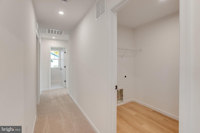 hall with light hardwood / wood-style flooring