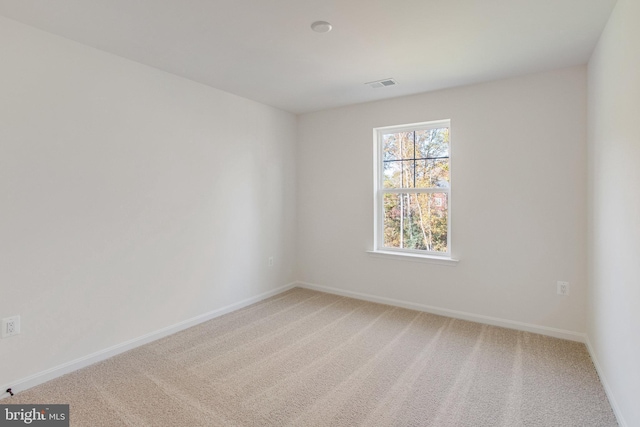 spare room featuring carpet floors