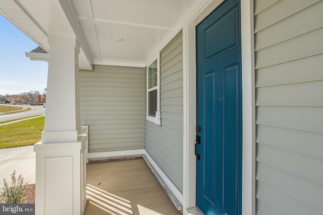 doorway to property featuring covered porch