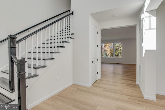 staircase featuring hardwood / wood-style floors