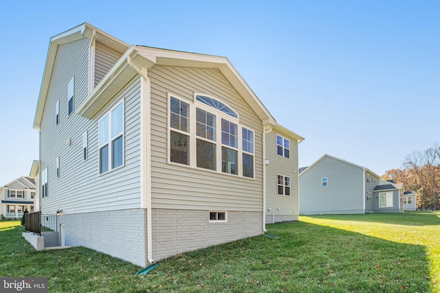 view of property exterior featuring a lawn