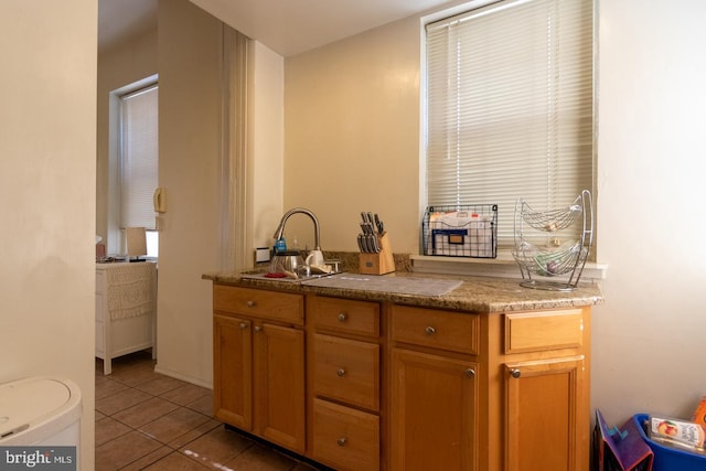 kitchen with sink and tile patterned floors