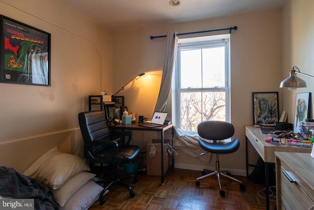 office space featuring dark parquet flooring