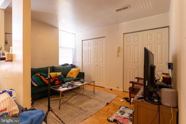 living room featuring light parquet floors