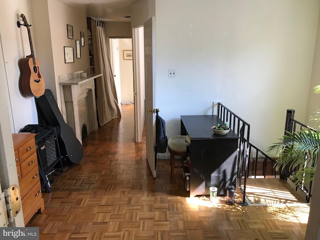 hallway featuring dark parquet flooring