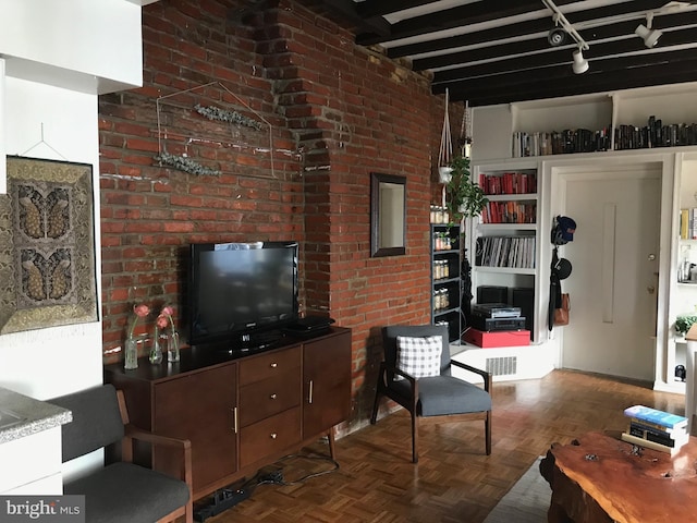 living room featuring parquet floors and beam ceiling