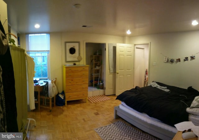 bedroom featuring light parquet flooring