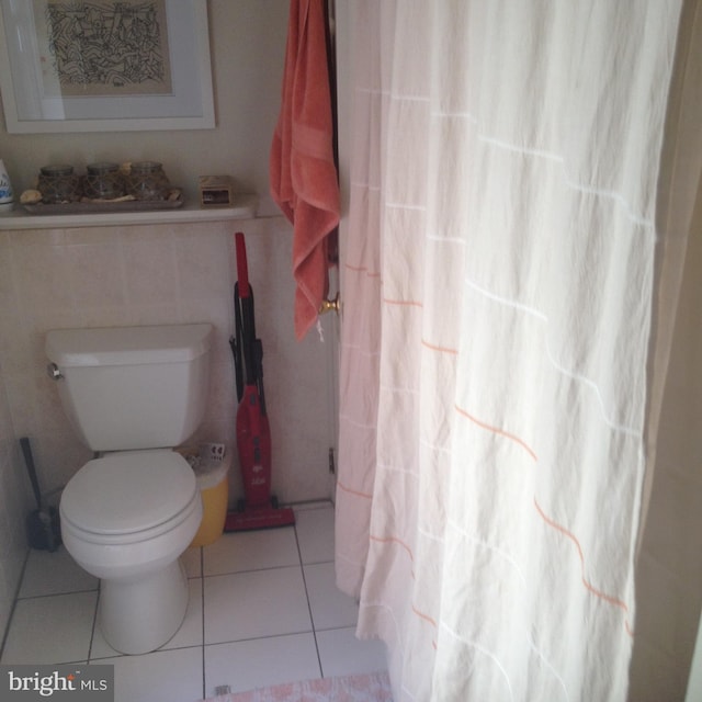 bathroom featuring tile patterned floors and toilet