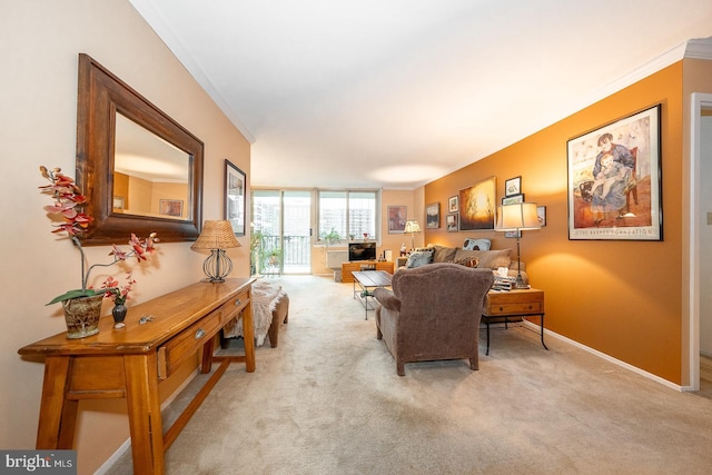 carpeted living room with crown molding