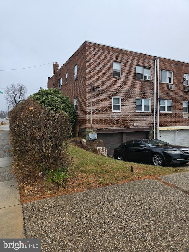 view of side of home with a garage