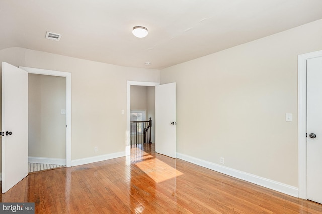 unfurnished bedroom with wood-type flooring