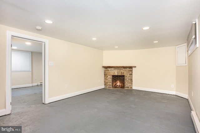 unfurnished living room featuring a baseboard heating unit