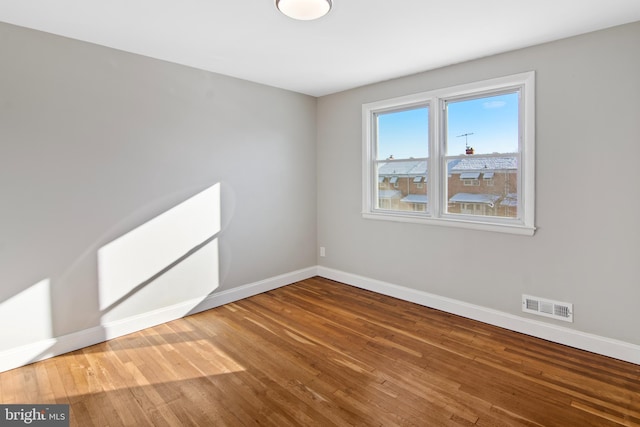 empty room featuring hardwood / wood-style floors