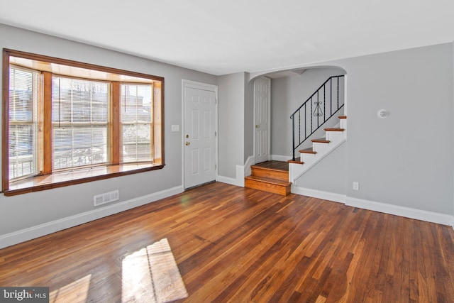 entrance foyer featuring wood-type flooring