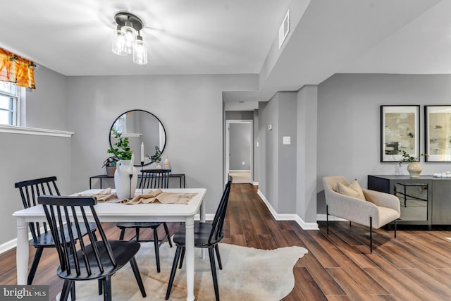 dining space featuring dark hardwood / wood-style flooring