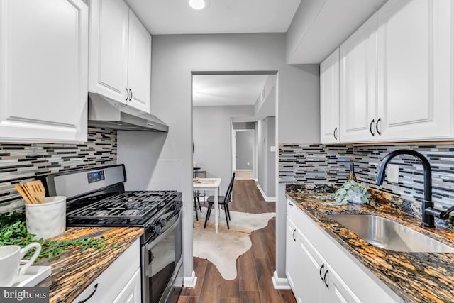 kitchen featuring white cabinets, dark hardwood / wood-style flooring, gas stove, and sink