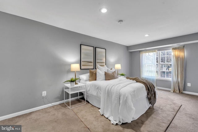 bedroom with light carpet