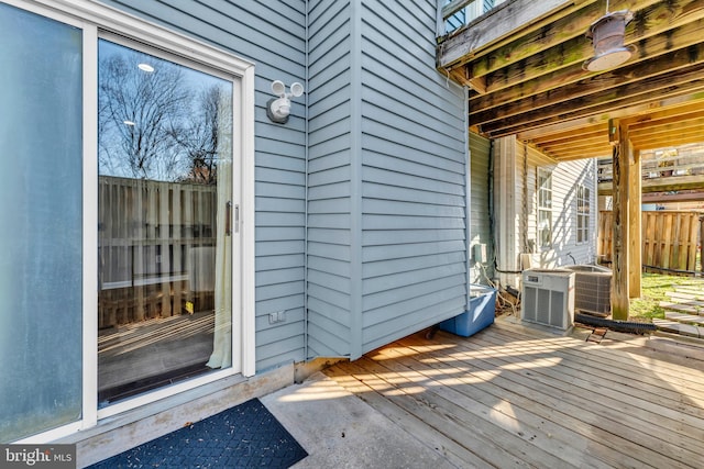 wooden deck with central AC unit