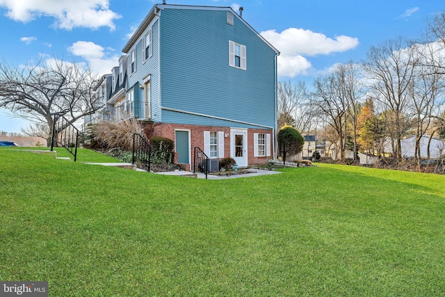 view of property exterior featuring a lawn