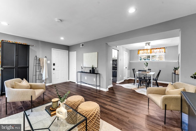 living room featuring dark hardwood / wood-style flooring