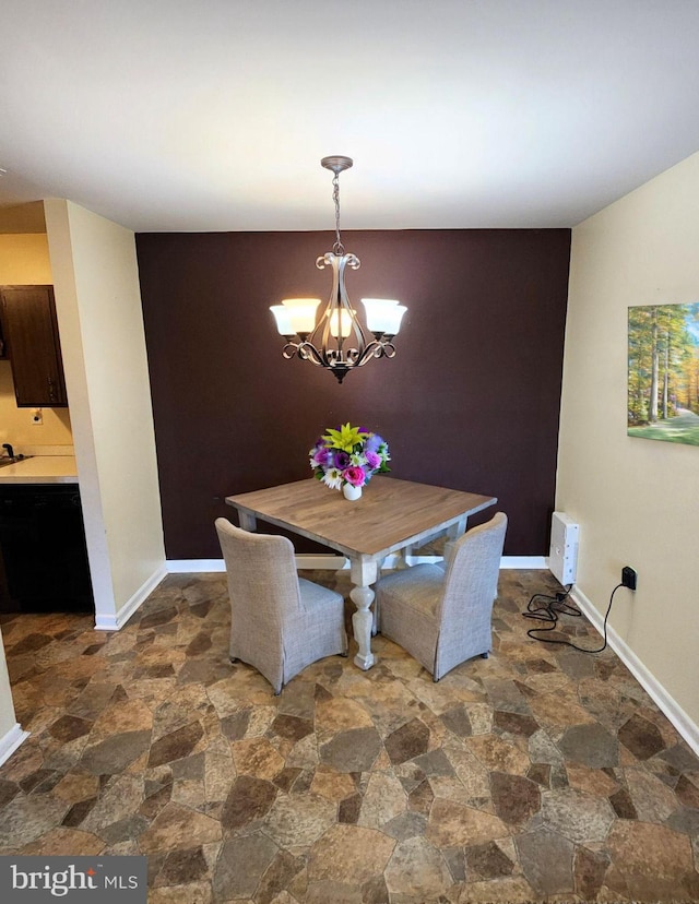 dining area featuring a notable chandelier