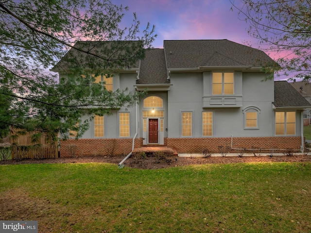 front facade with a lawn