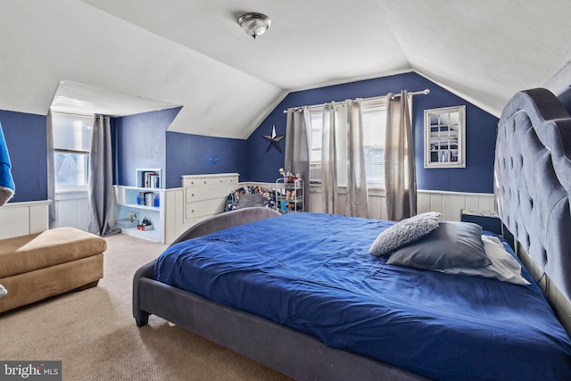 carpeted bedroom featuring lofted ceiling