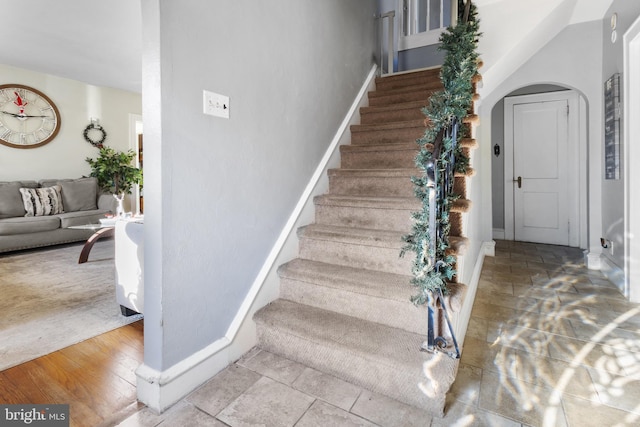 stairs with wood-type flooring