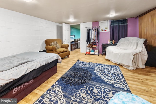 bedroom with wood-type flooring