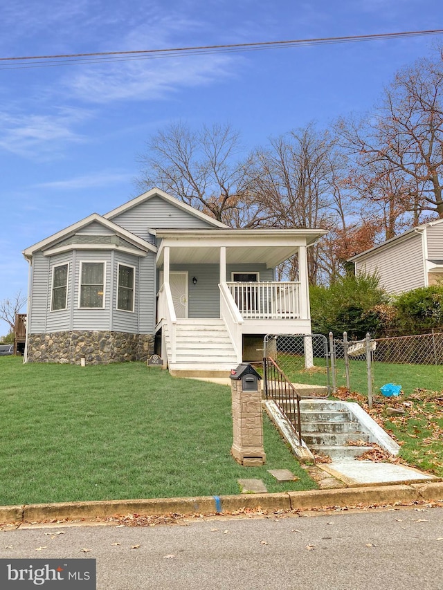 bungalow featuring a porch and a front lawn