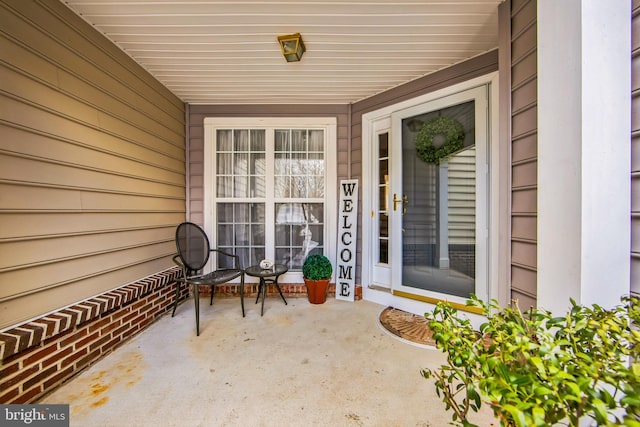 property entrance featuring a patio