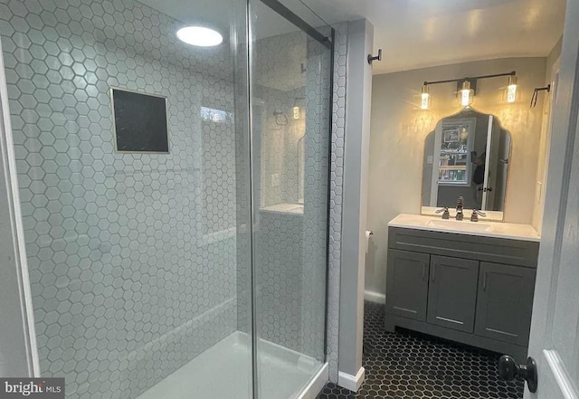 bathroom featuring vanity, tile patterned floors, and a shower with door