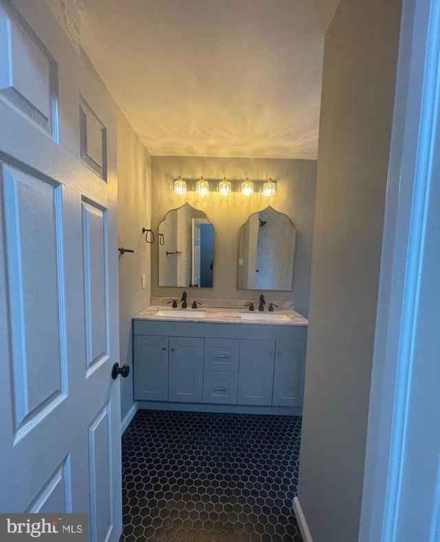 bathroom featuring tile patterned flooring and vanity