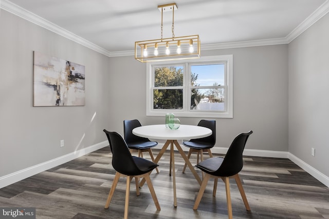 dining room featuring an inviting chandelier, crown molding, and dark wood-type flooring