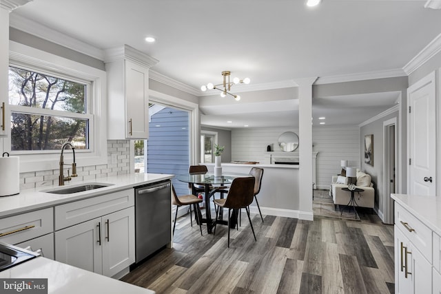 kitchen featuring white cabinetry, dishwasher, sink, dark wood-type flooring, and backsplash