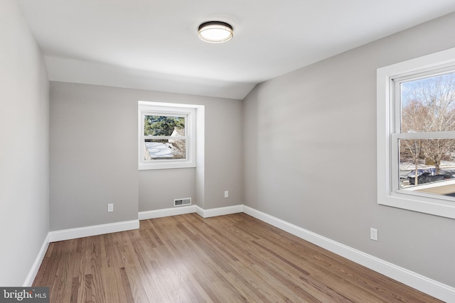 spare room with light wood-type flooring