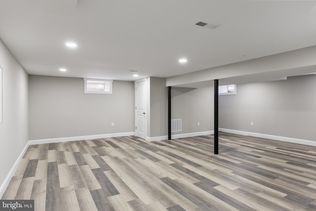 basement featuring light hardwood / wood-style flooring