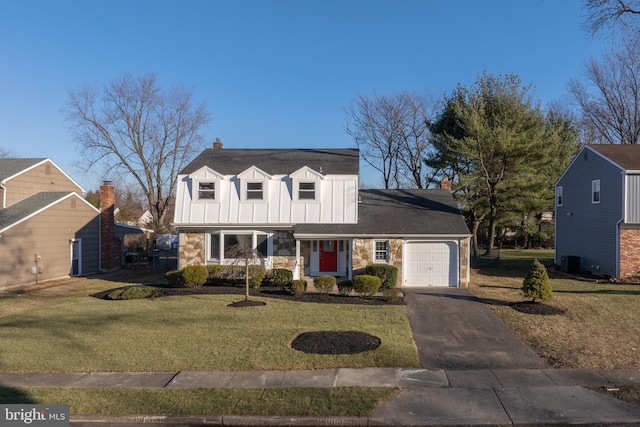 cape cod-style house with a garage and a front lawn